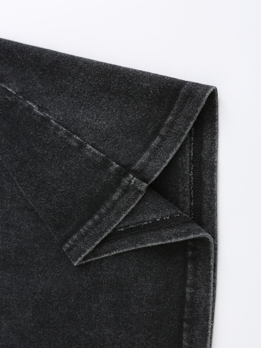 Close-up of soft, dark gray fabric with a slight stretch, perfect for casual wear and t-shirts.