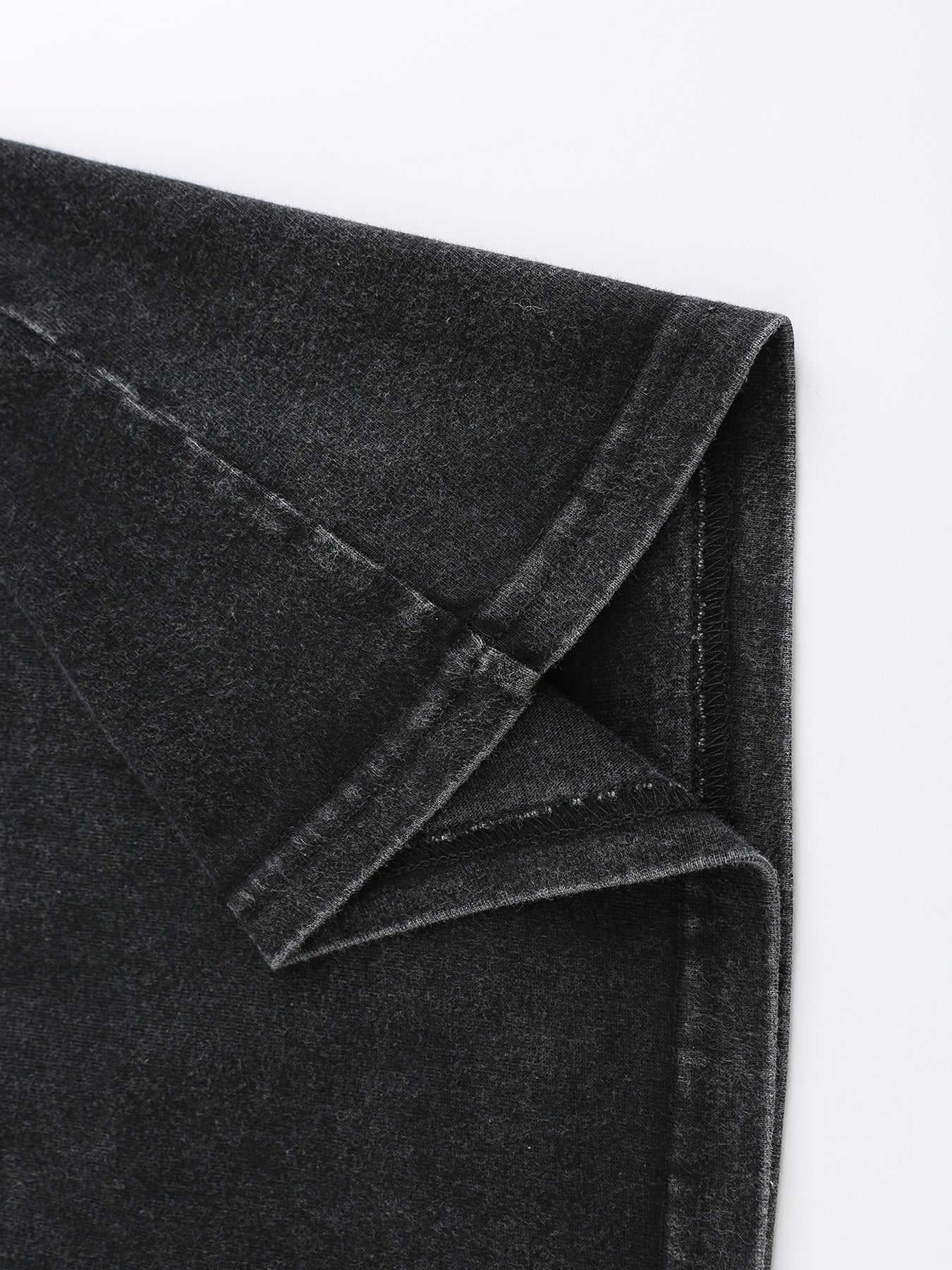 Close-up of soft, dark gray fabric with a slight stretch, perfect for casual wear and t-shirts.