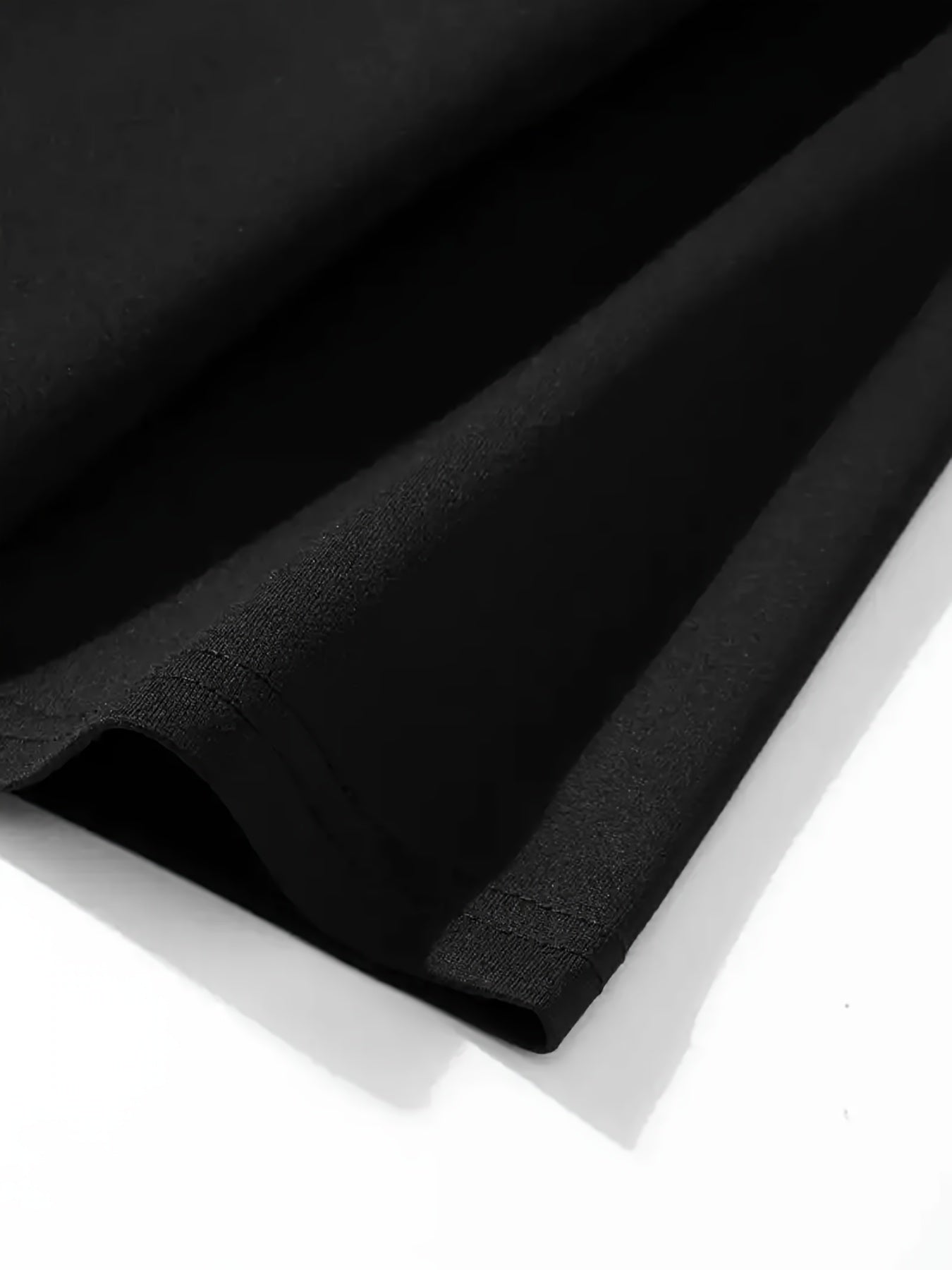 Men's retro washed graphic T-shirt featuring anime design with colorful characters on a black background.