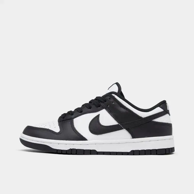 Women's Nike Dunk Low Retro shoes in black and white, featuring a sleek design and casual style.