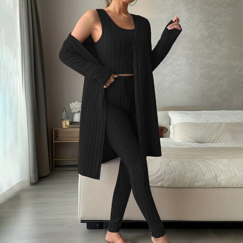 Woman wearing anime and more women's ribbed knit pajama set in gray, featuring a long cardigan and fitted bottoms.