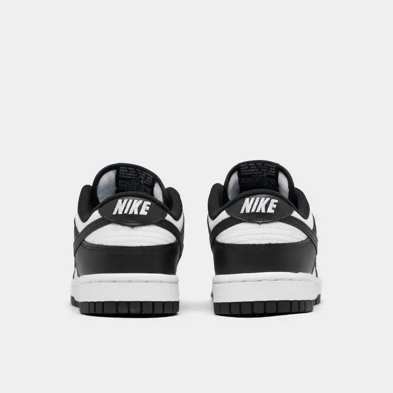Women's Nike Dunk Low Retro shoes in black and white, featuring a sleek design and casual style.