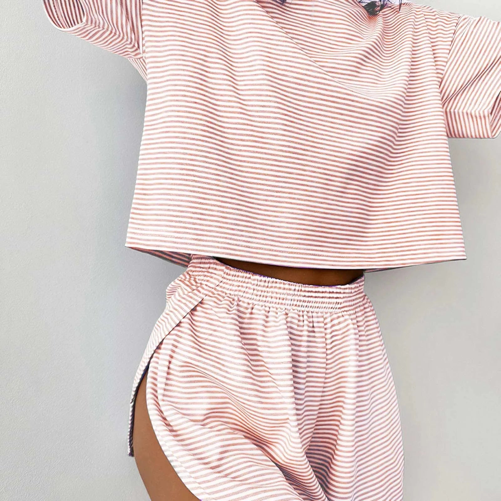Women's striped pajama set with short sleeve t-shirt and elastic waistband shorts in comfortable fabric.