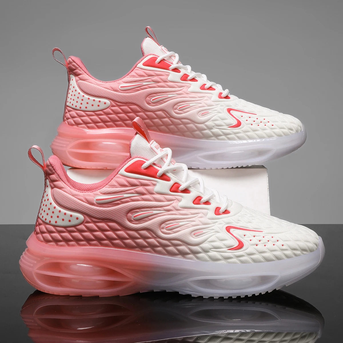 Stylish pink and white lace-up orthopedic sneakers for women with bubble sole and trendy design.