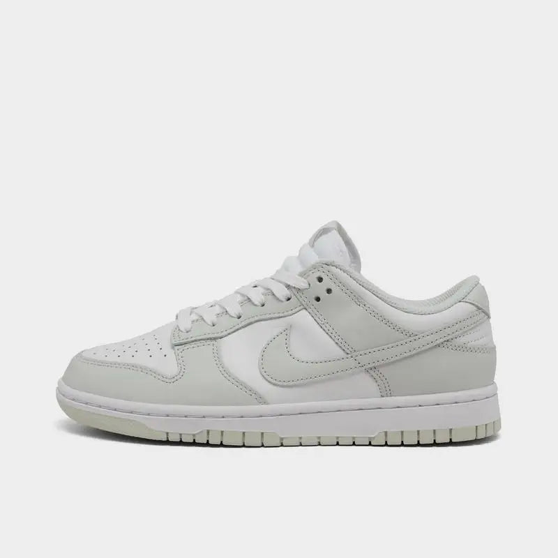 Women's Nike Dunk Low Retro shoes in black and white, featuring a sleek design and casual style.