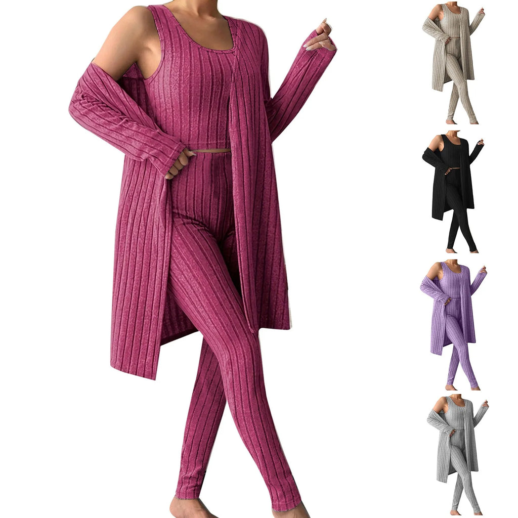 Woman wearing anime and more women's ribbed knit pajama set in gray, featuring a long cardigan and fitted bottoms.