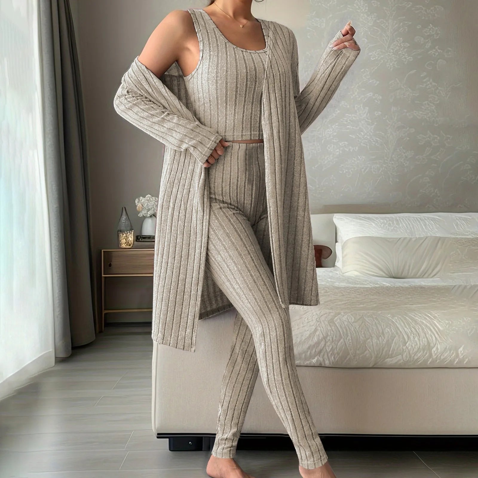 Woman wearing anime and more women's ribbed knit pajama set in gray, featuring a long cardigan and fitted bottoms.