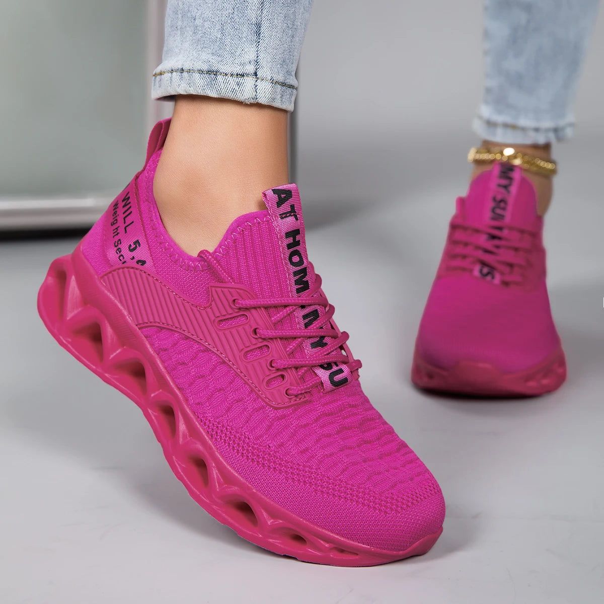 Bright pink orthopedic sneakers for women, featuring a lace-up closure and stylish design, perfect for comfort and style.