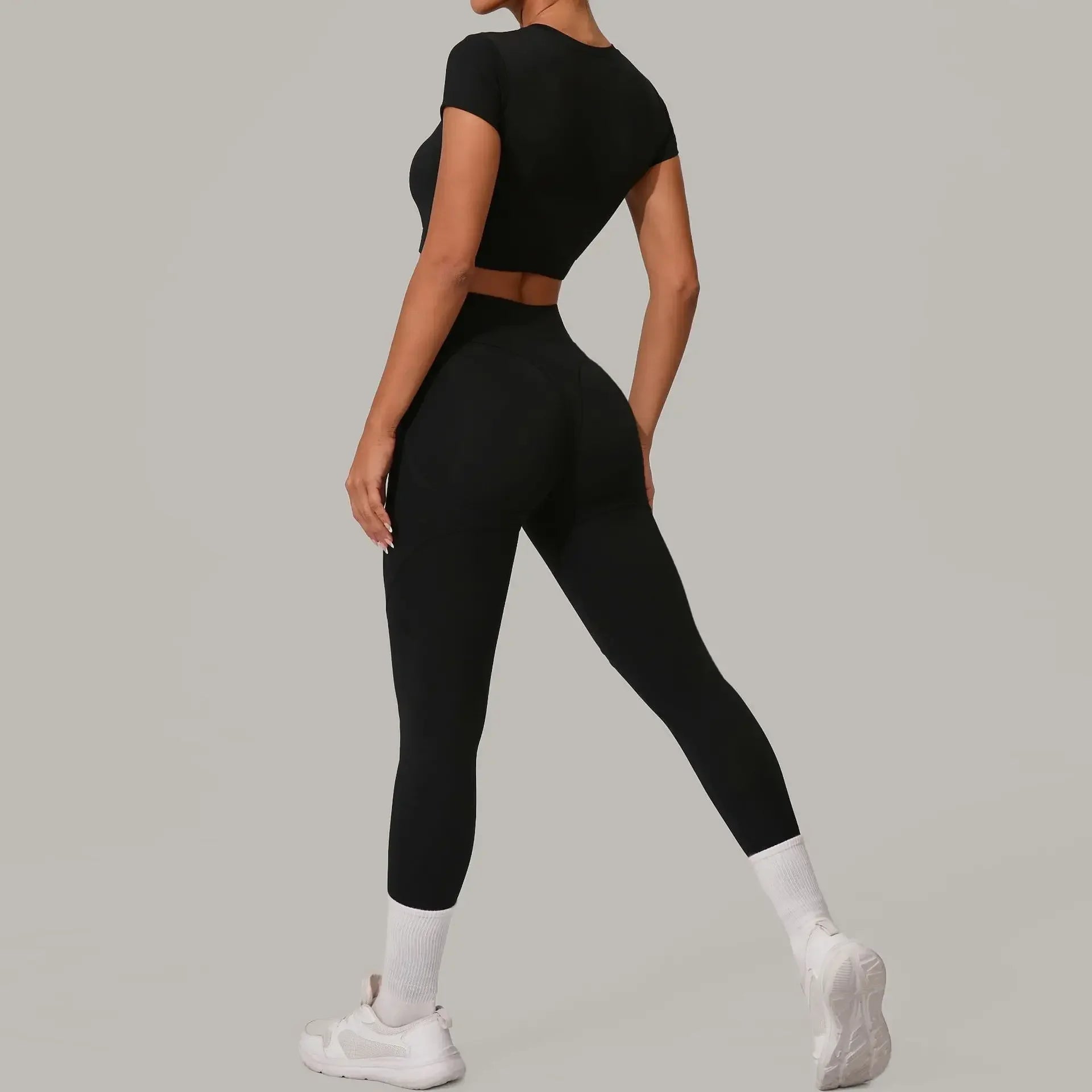 Women wearing seamless yoga sets in brown and beige, showcasing high waist and hip lift design, perfect for fitness activities.