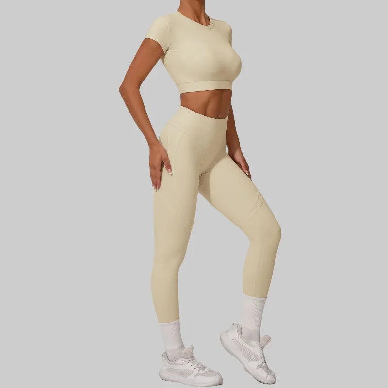 Women wearing seamless yoga sets in brown and beige, showcasing high waist and hip lift design, perfect for fitness activities.