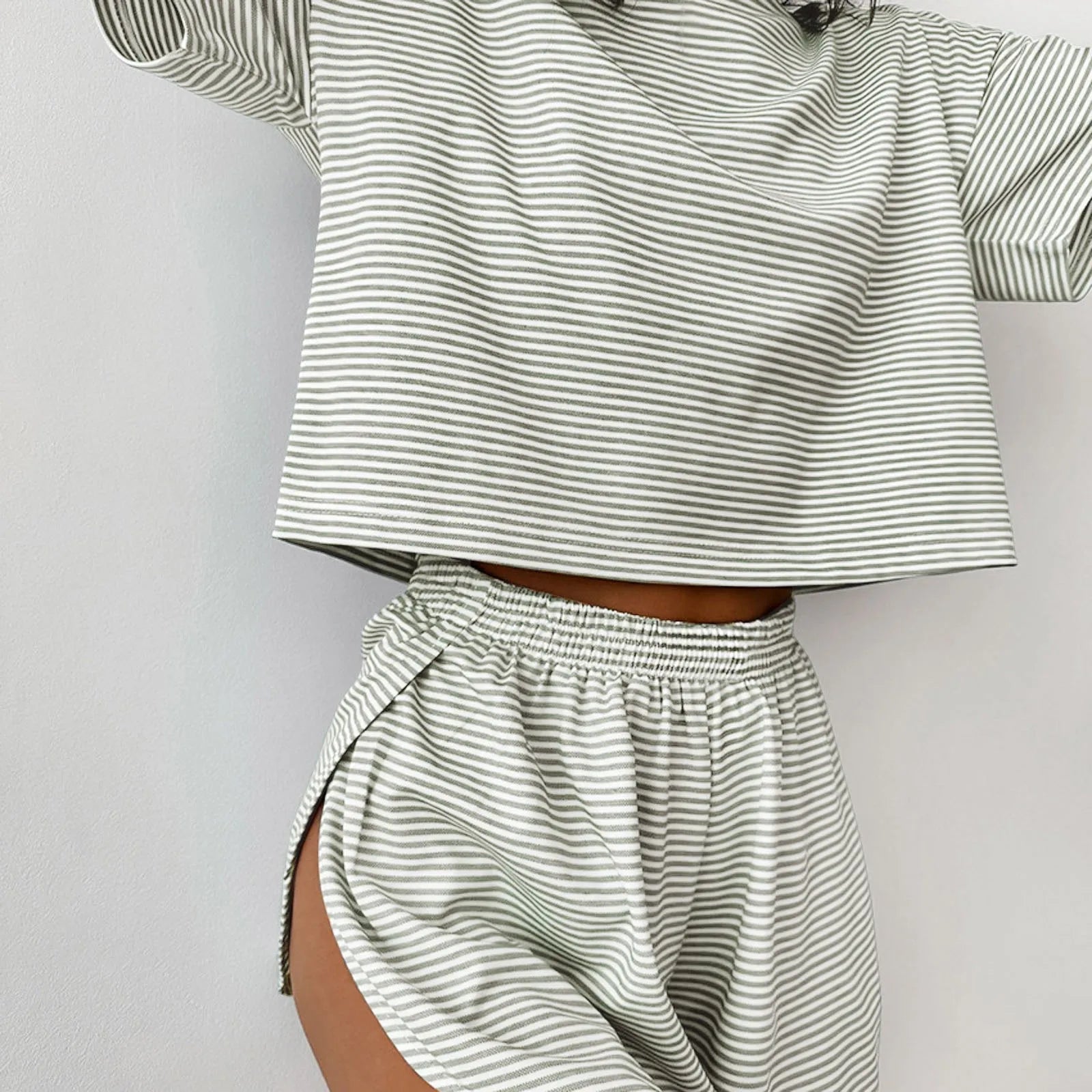 Women's striped pajama set with short sleeve t-shirt and elastic waistband shorts in comfortable fabric.