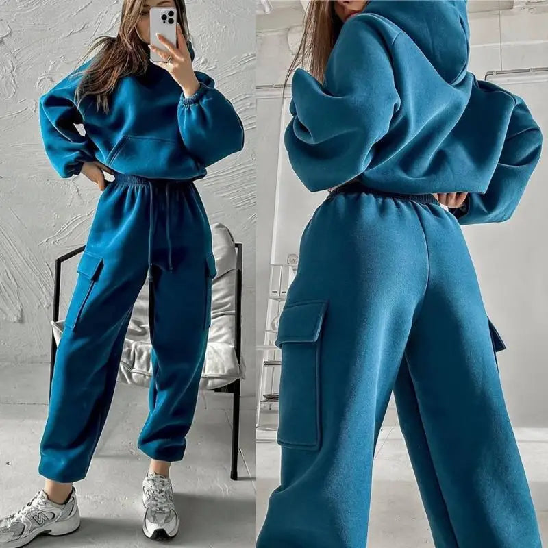 Women wearing a blue anime and more sweatsuit with a zip-up hoodie and cargo-style pants, perfect for spring activities.