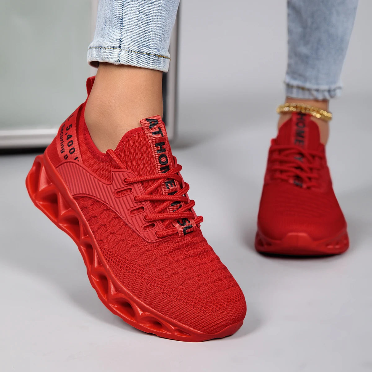 Bright pink orthopedic sneakers for women, featuring a lace-up closure and stylish design, perfect for comfort and style.
