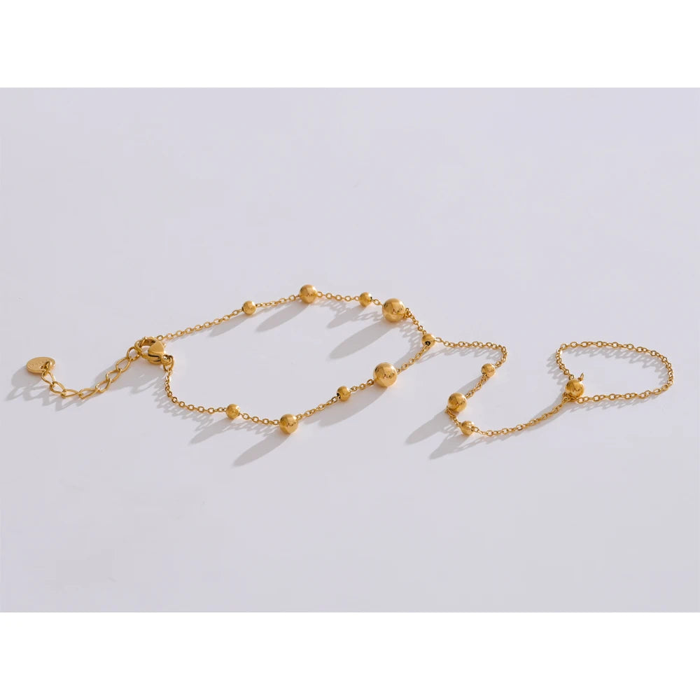 Trendy stainless steel link chain bracelets with zircon beads in gold and silver colors.