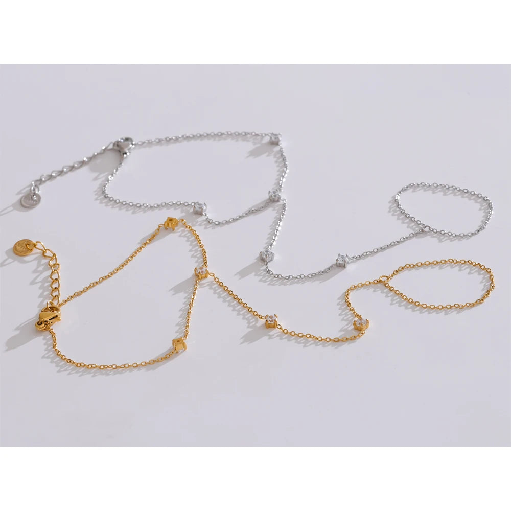 Trendy stainless steel link chain bracelets with zircon beads in gold and silver colors.