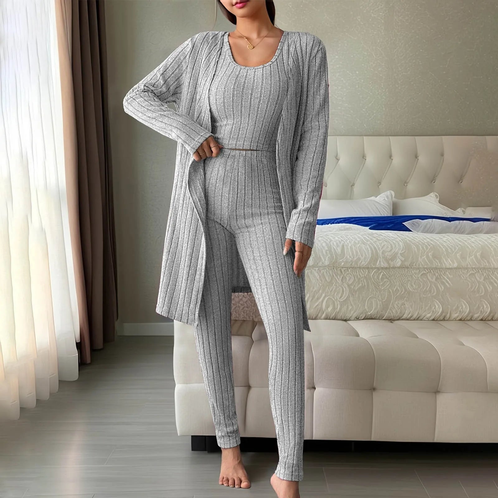 Woman wearing anime and more women's ribbed knit pajama set in gray, featuring a long cardigan and fitted bottoms.