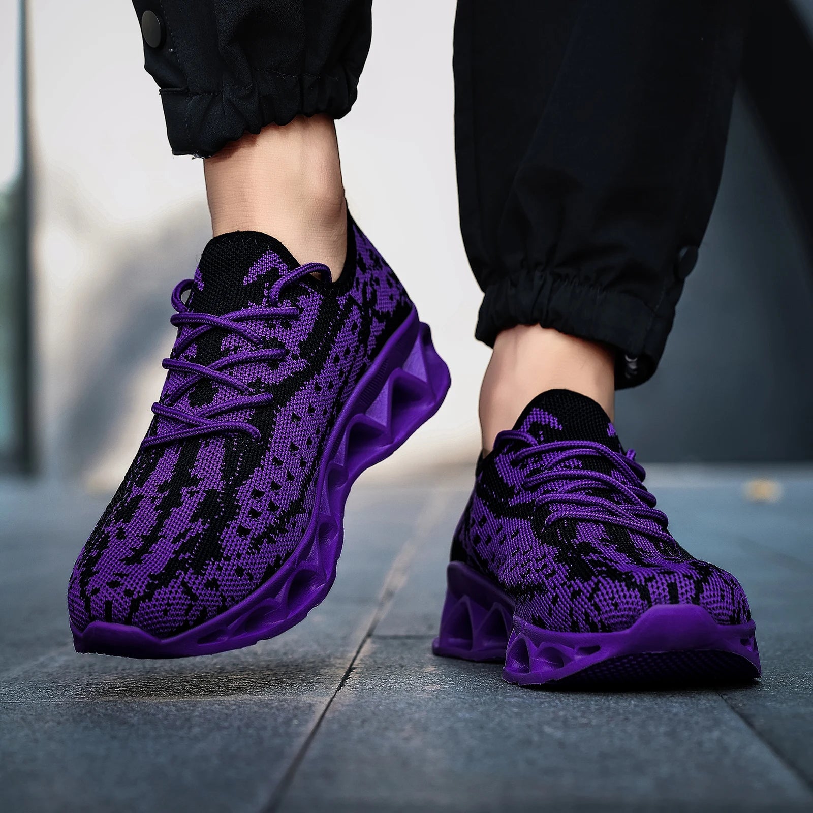Purple and black patterned orthopedic sneakers for women, featuring a lace-up closure and flat heel design.