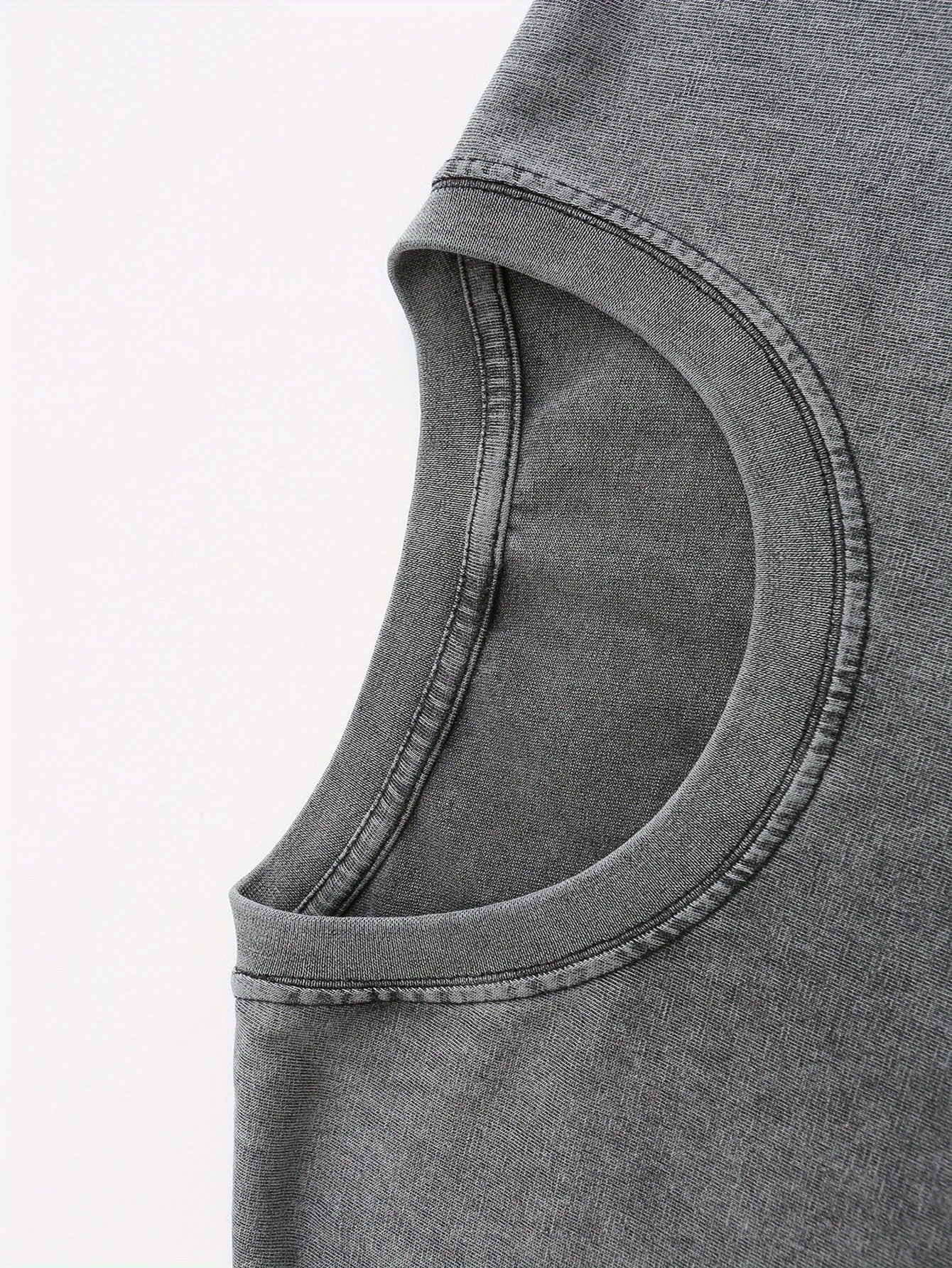Close-up of soft, dark gray fabric with a slight stretch, perfect for casual wear and t-shirts.