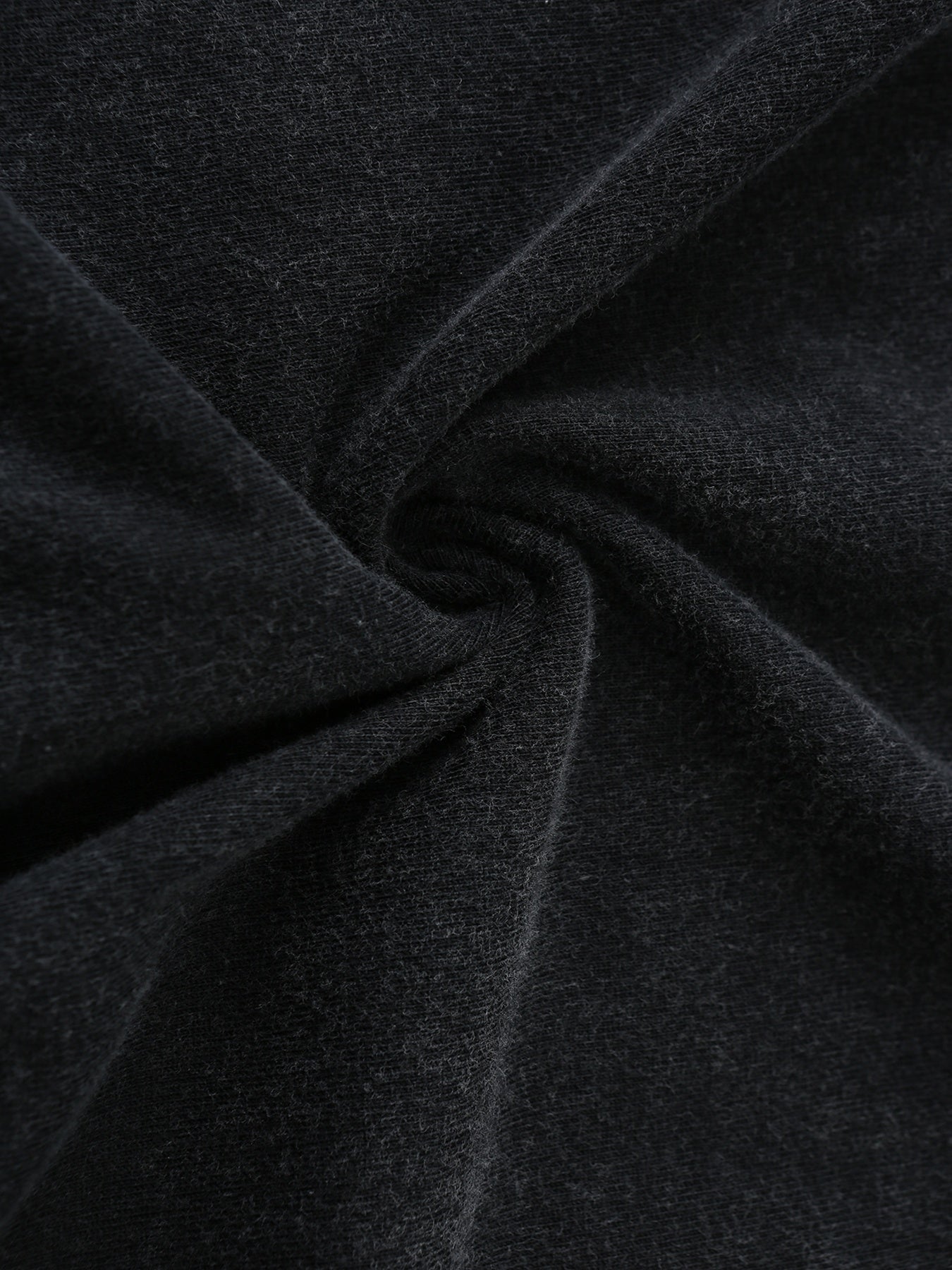 Close-up of soft, dark gray fabric with a slight stretch, perfect for casual wear and t-shirts.