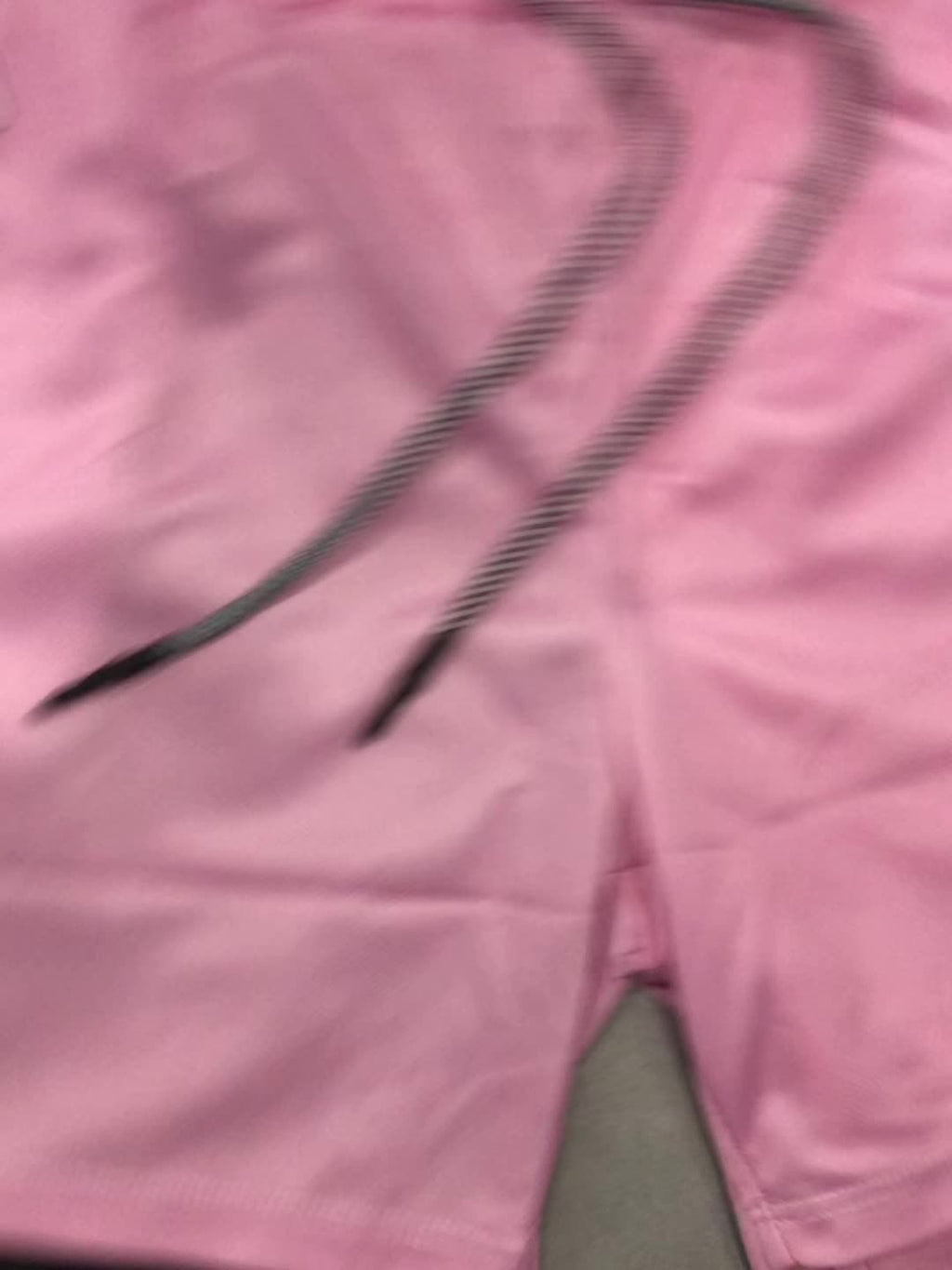 Pink anime-inspired 2-in-1 men's shorts with floral design and a black inner layer, featuring a drawstring waist.