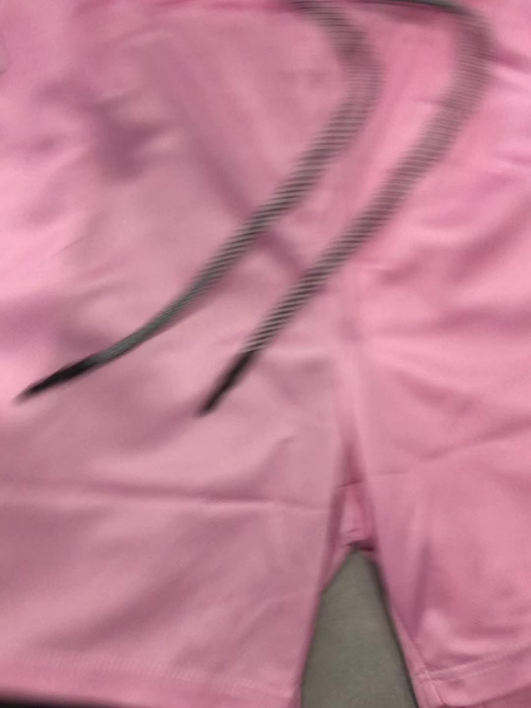 Pink anime-inspired 2-in-1 men's shorts with floral design and a black inner layer, featuring a drawstring waist.